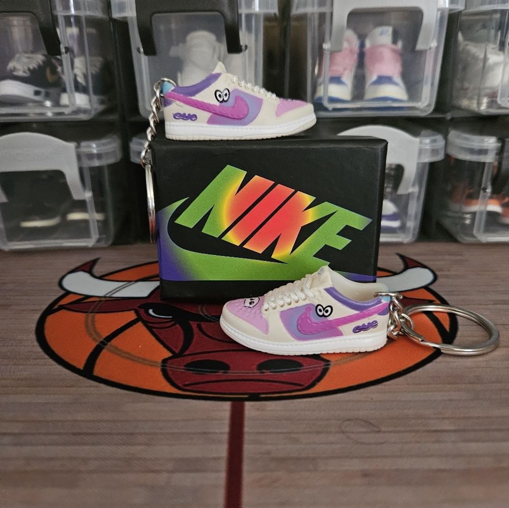 Nike SB pair of mini sneakers keychain.